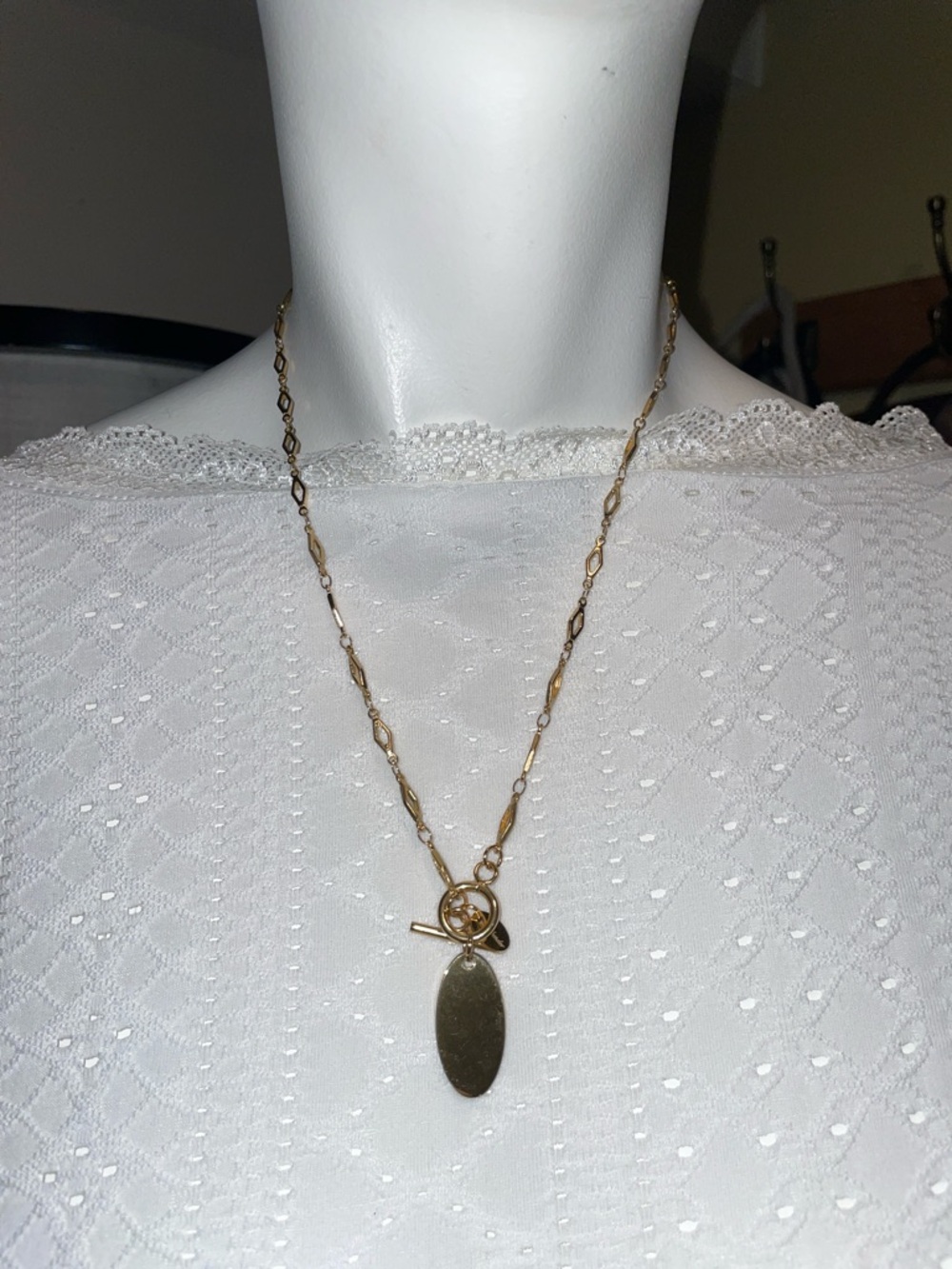 Plunder Gold Tone with an Oval Charm Necklace
